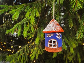 Ceramic Christmas decoration Old Tower on tree with lights. Tallinn Christmas Market