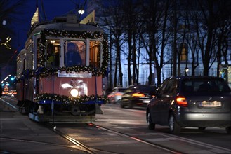 Vienna/Austria/ december 16, 2017: Old Tram crossing fast through the city of Vienna