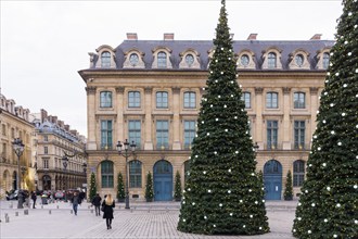 Paris Christmas - Christmas trees in a decorated Place Vendome in the 1st arrondissement of Paris, France, Europe.