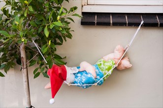 After the Christmas deliveries, Santa Claus takes a well-earned rest in suburban Melbourne, Australia