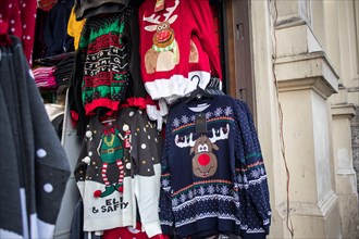 London, UK - December 2nd, 2019. A temporary seasonal display of ugly Christmas sweaters at a retail store .