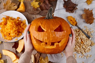 Making scary pumpkin jack for Halloween, holiday preparation