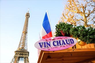 PARIS, FRANCE - DECEMBER 26, 2015: Hot mulled wine ("vin chaud" in French) for sale Christmas market near Eiffel tower.