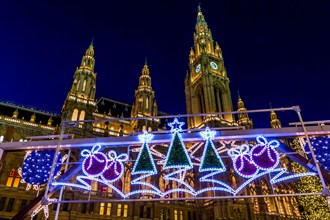 Rathaus and Christmas lights at night in Rathausplatz, Vienna, Austria, Europe