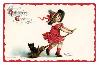 Vintage Halloween greeting card / postcard. Early 1900s. A cute girl on a broom with a black cat kitten.