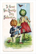 Vintage Halloween greeting card / postcard. Early 1900s. To Greet You Heartily This Halloween. Pumpkin couple.