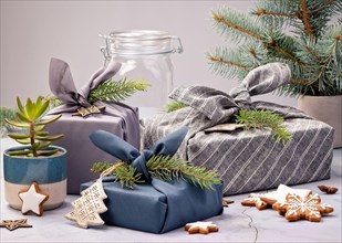 Eco Friendly Holiday Concept. Furoshiki Wrapped Cloth Gifts for Zero Waste Christmas.