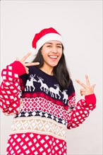 Christmas ugly sweater. Latin venezuelan woman wearing a fashion woolen xmas style