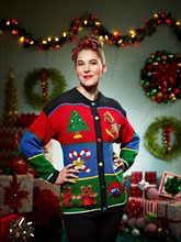 Portrait of woman in ugly Christmas sweater looking into camera with pride