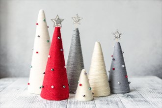 Handmade Christmas trees. Yarn wrapped cone trees. XMAS gifts. DIY concept