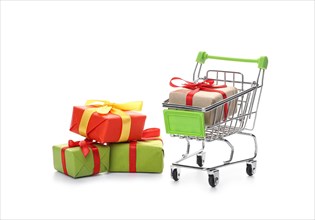 Shopping cart with gift boxes on white background