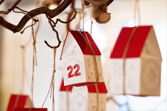 Advent calendar consisting of handmade little houses with the 22 in focus