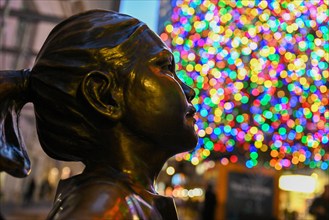 The Fearless Girl statue stands in front of the New York Stock Exchange (NYSE) on Wall Street on December 2, 2022 in New York.