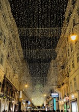 Vienna, Austria, Dec. 2019: Kohlmarkt in Vienna before Christmas, illuminated by Christmas Lights