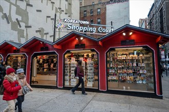 A pop-up holiday market offers gift ideas in Koreatown at the intersection of fifth Avenue and 32nd St. in New York City, 2023, USA