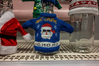 Ugly christmas sweater fitting a glass flask