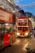 London bus covered in  Christmas lights in Regents Street Christmas 2024. Location  the West End of London