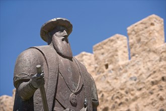 A statue of Vasco de Gama in Sines Portugal looks out over the ocean from a hilltop vantage point next to the old fort