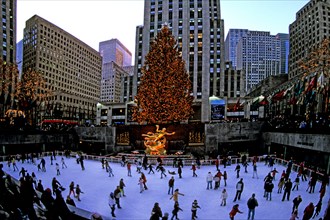 New York City Rockefeller Center at Christmas with tree and ice skaters