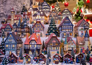 Traditional lanterns in shape of old model houses for sale on craft stall in Cologne Christmas Market in Germany in Germany