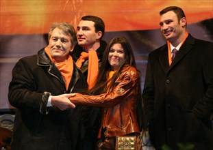 Dec 22, 2004 - Kiev, Ukraine - The Ukrainian opposition has noted month Orange Revolution. The leader of opposition VICTOR JUSHCHENKO (L), Singer RUSLANA LYZHECHKO with Ukrainian boxers, brothers VITA...