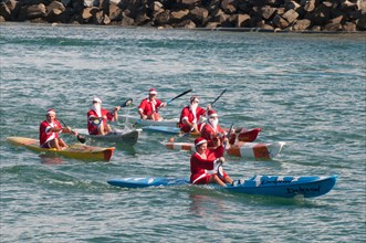 Kayakers celebrating Christmas Day on the Sunshine Coast, Queensland, Australia