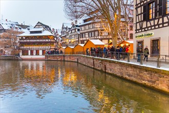 Christmas market at dusk Petite France (little France), Strasbourg, Alsace, Bas Rhin France