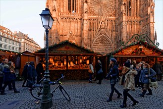 France, Bas Rhin, Strasbourg, old town listed as World Heritage by UNESCO, Christmas market (Christkindelsmarik), place de la Cathedrale with Notre Dame Cathedral