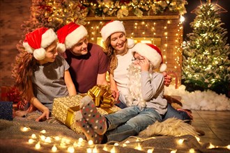 Happy family in a room  at Christmas.