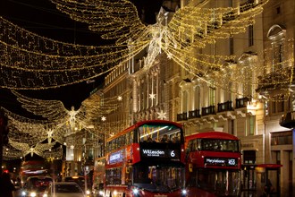 LONDON, UK - DECEMBER 4th, 2017: Christmas lights on Regents Street St James. Beautiful Christmas decorations attract  shoppers and tourists during th