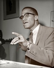 Malcolm X in Chicago, Illinois. May, 1961. Nation of Islam and Black Muslim leader. Image toned from 2.25 x 2.25 inch B&W negative.