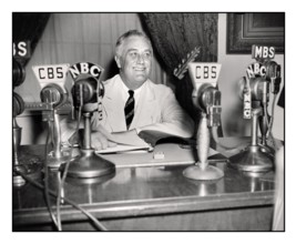 PRESIDENT ROOSEVELT 1930's FDR Franklin D. Roosevelt giving a radio broadcast (“fireside chat”) September 1934. On his desk CBS & NBC network broadcast microphones. Franklin Delano Roosevelt Sr., ofte...