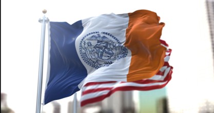 the official flag of New York City flapping along with the American Stars and Stripes national flag in the background. Official seal of New York City.