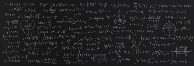 Formulas and calculations from mathematics and geometry on school blackboard