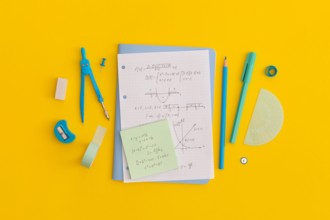 School stationery on a yellow background. Top view with copy space. Flat lay. Back to school concept.