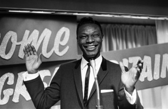 Nat King Cole, American singer, and pianist performing in London.   He flew in earlier in the day from his European tour. Picture taken 12th May 1960