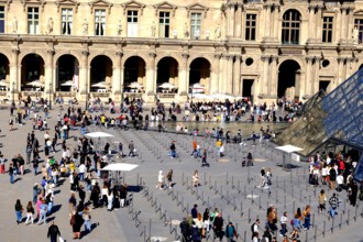 People preparing to enter the Louvre Museum in Paris France