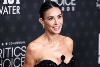 SANTA MONICA, LOS ANGELES, CALIFORNIA, USA - FEBRUARY 07: Demi Moore wearing Schiaparelli arrives at the 30th Annual Critics' Choice Awards held at The Barker Hangar on February 7, 2025 in Santa Monic...