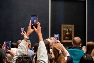 Crowds at Mona Lisa Painting in Louvre Museum, Paris, France