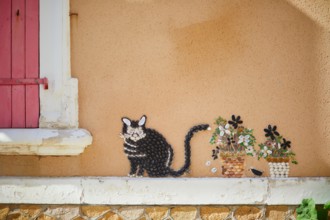 Beautiful art decorations made from shells and pebbles on walls in Ile Penotte, Les Sables d'0lonne of the department of Vendee, Pays de la Loire, Fra