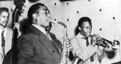 CHARLIE PARKER in middle with fellow US jazz musician Miles Davis