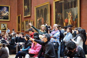 People viewing paintings, Musee du Louvre in Paris, France - Jan 2012