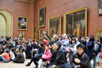 People viewing paintings, Musee du Louvre in Paris, France - Jan 2012