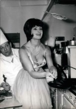 Jan. 30, 1961 - Flapjacks or Candlemas: Photo shows Franco-Italian starlet Silivia Sorente trying her hand at throwing up the pancakes while the chef looks on. (''Throwing Up'' pancakes is an old Fren...