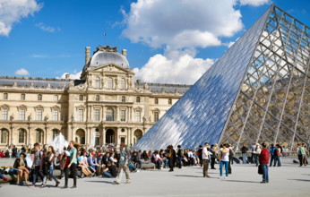 Turists resting at Louvre Museum, Paris, France