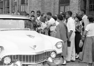 Nat King Cole signing autographs