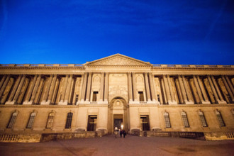 The Claude Perrault’s Colonnade in Paris by night, France. It is the easternmost façade of the famous Palais du Louvre.