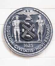 The seal of the City of New York on the side of a school in New York on Saturday, April 15, 2017. (© Richard B. Levine)