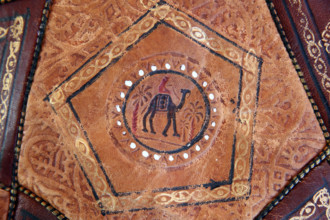 Moroccan brown leather sofa with camel.  France.