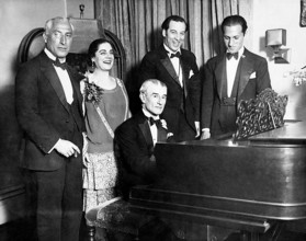 MAURICE RAVEL French composer at piano in 1928 celebrating his birthday with George Gershwin at right and Eva Gauthier